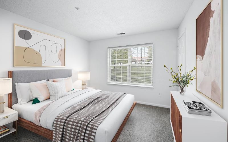 a bedroom with a bed and a desk