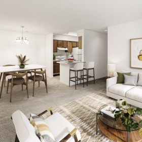 a living room with a dining table and couches
