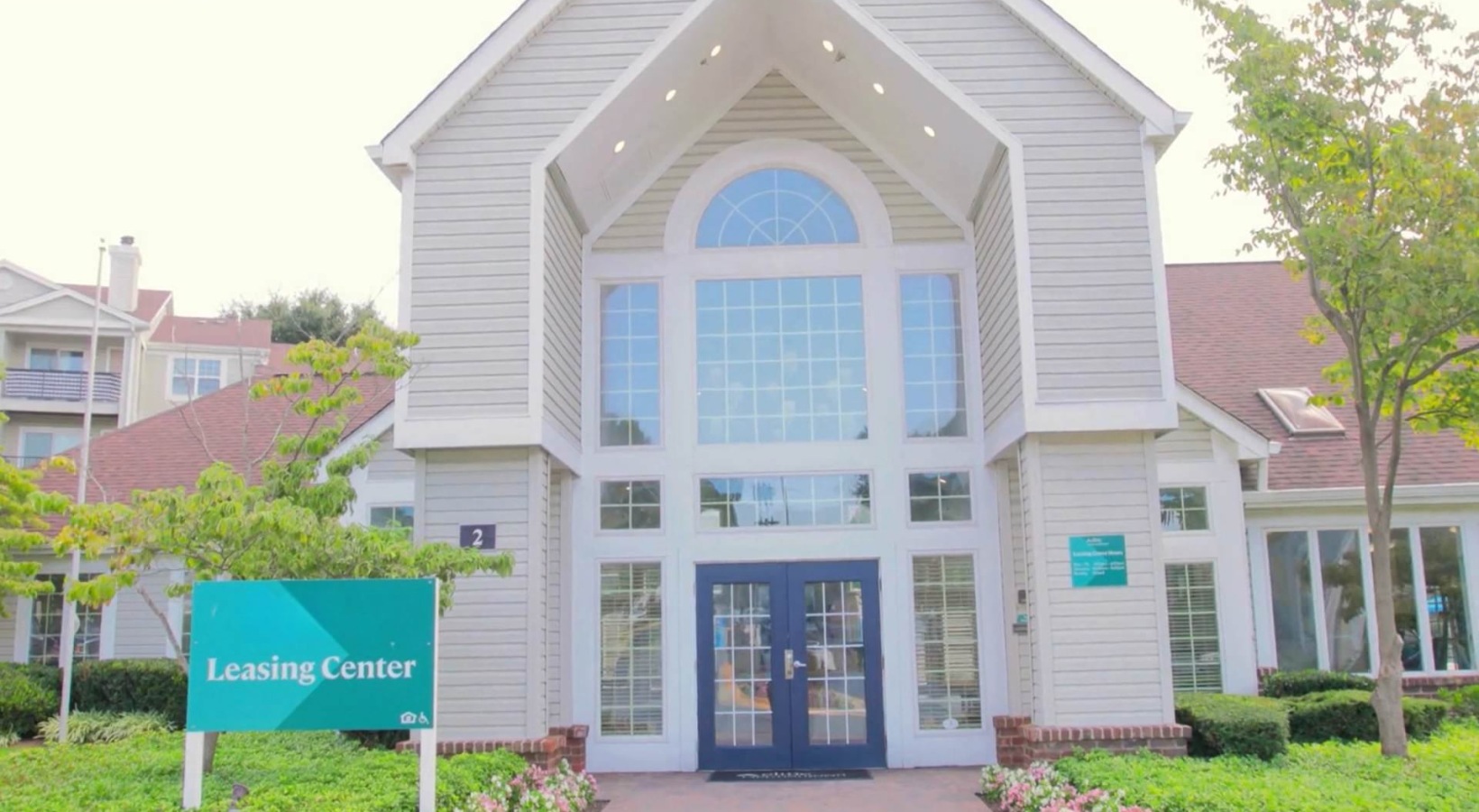 a large building with a sign and windows